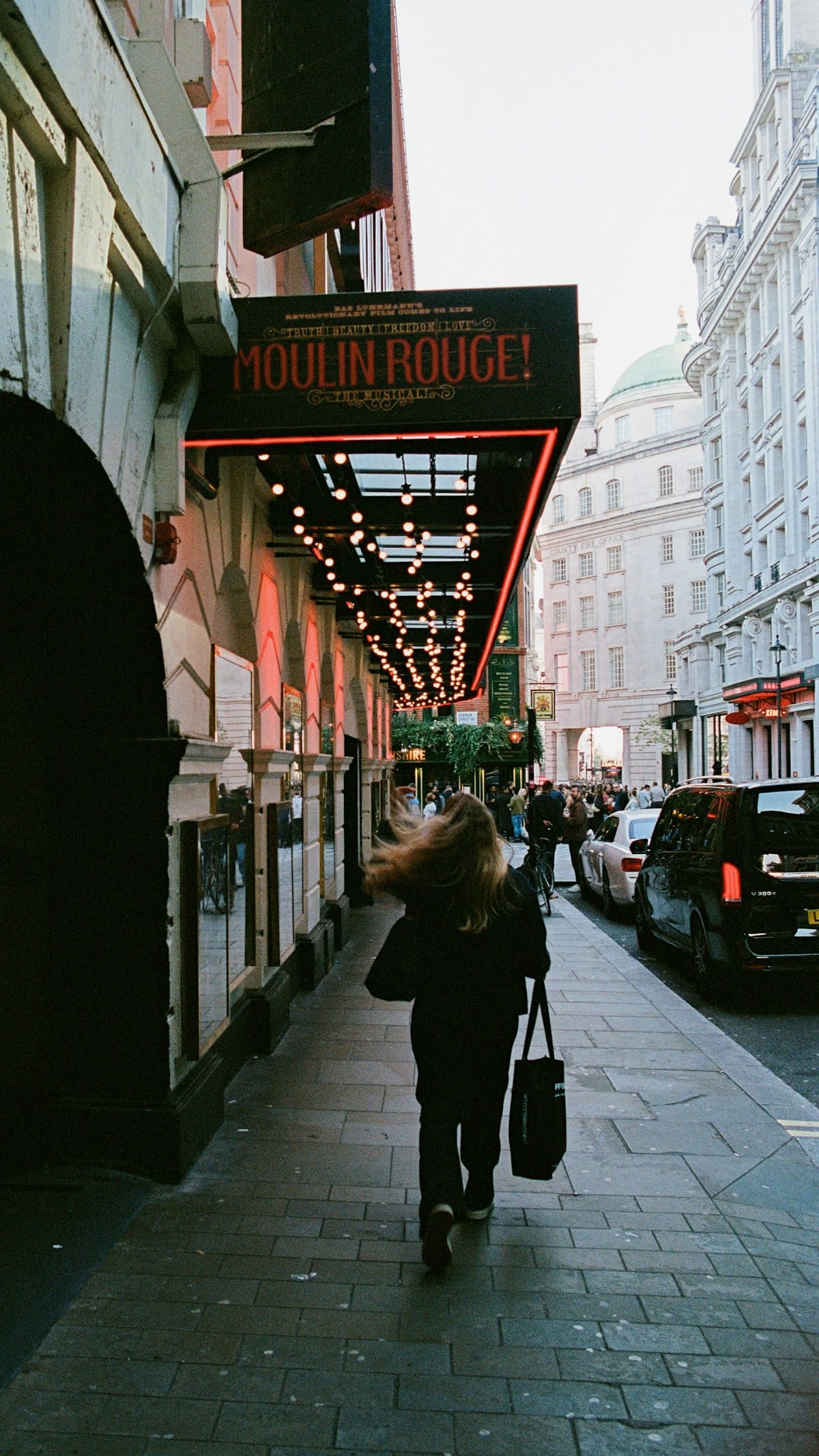 Moulin Rouge theatre sign on a Soho street in London